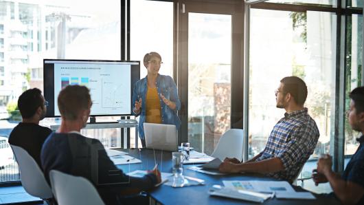 a confident presentation being given in a well-lit room