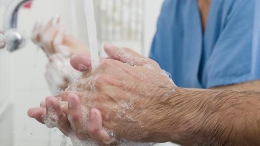 Clinican washing hands.