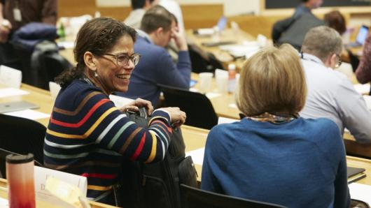 Physicians in an academic lecture hall