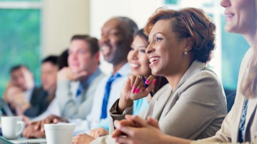 People seated and smiling