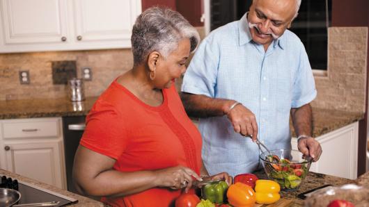 Adults cooking a healthy meal