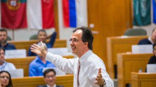 Professor Stefan Thomke animatedly teaching in a classroom of executives